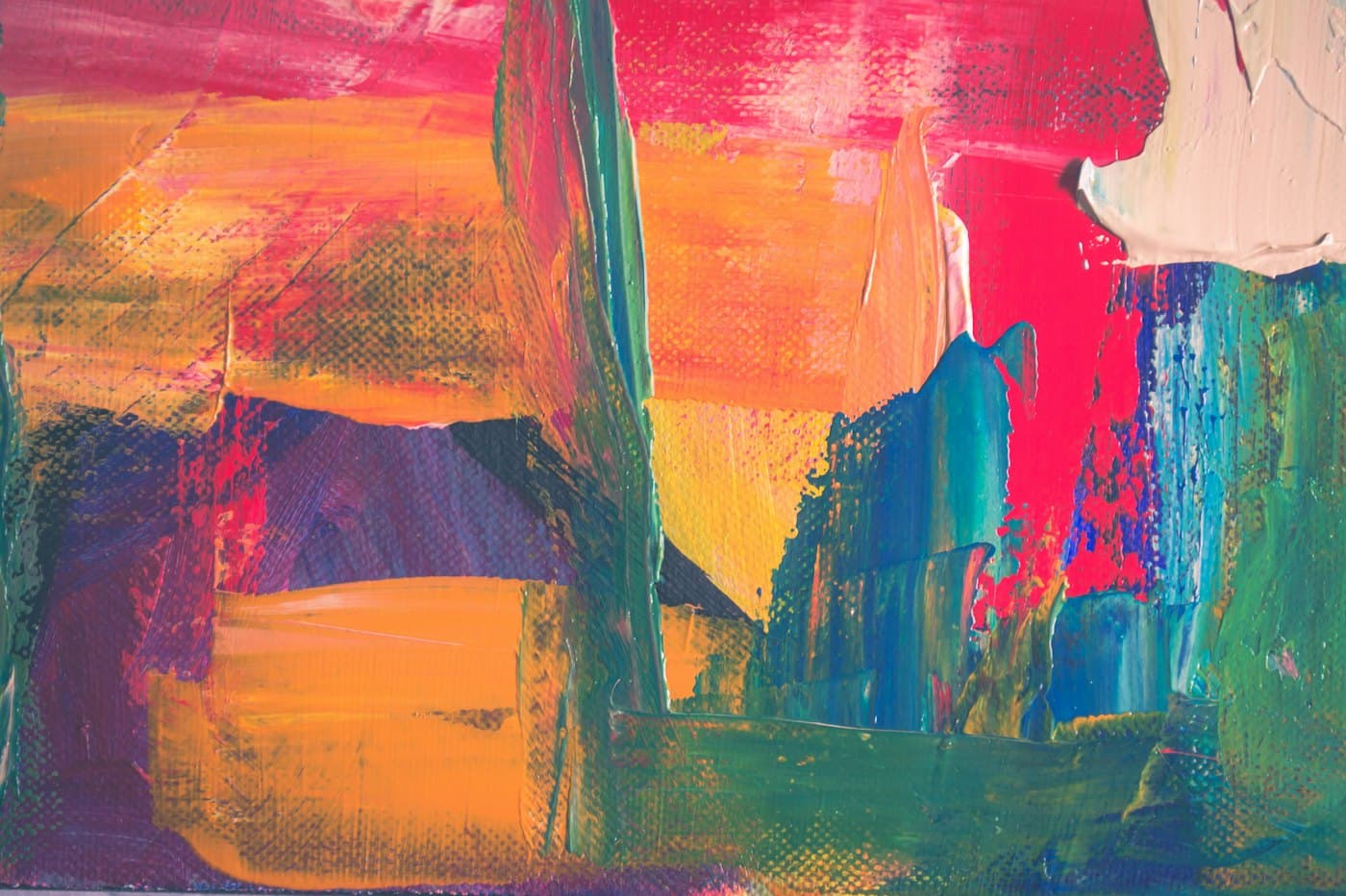 Bold strokes of red, yellow, pink, and teal paint